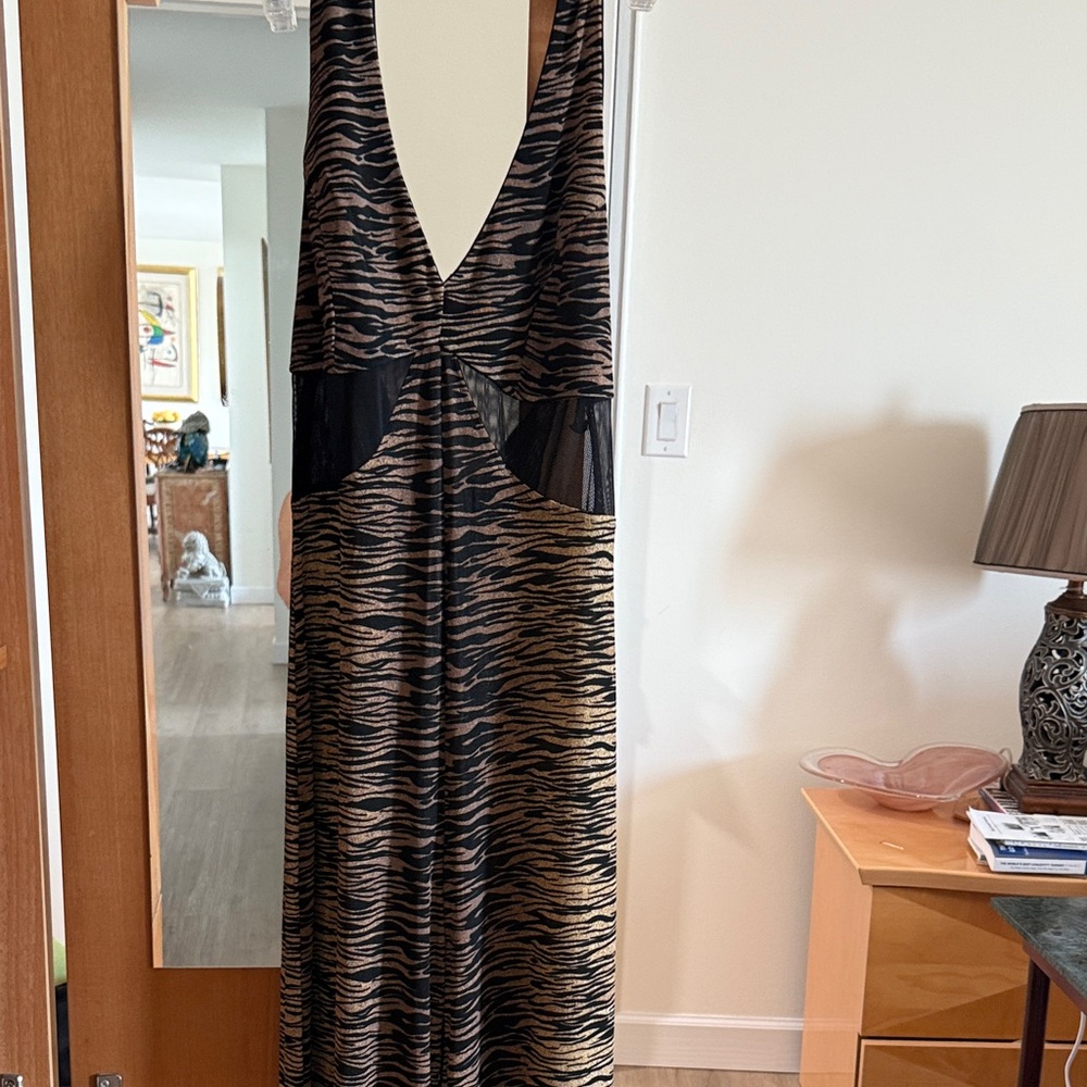 A jumpsuit in an animal print open and see thru for casual n lounging wear